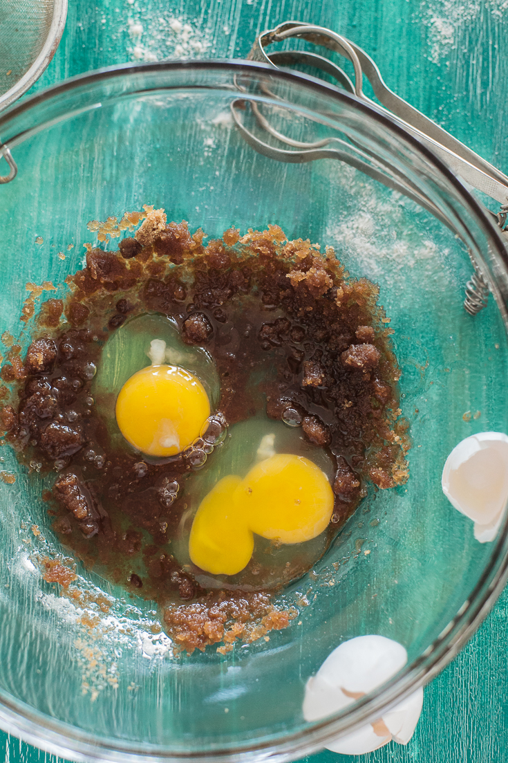 Two whole eggs in whole wheat banana bread mixture